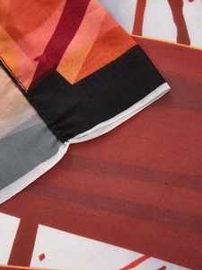 Detailed close-up of geometric pattern fabric with fine hem stitching on Halloween decor