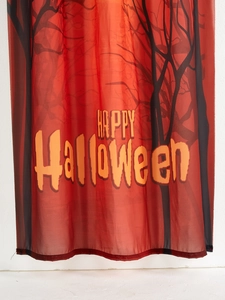 Detail of Halloween door curtain featuring spooky black trees and Happy Halloween text