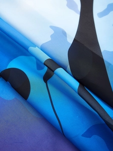 Detailed macro view of the blue camouflage fabric texture and polyester weave pattern
