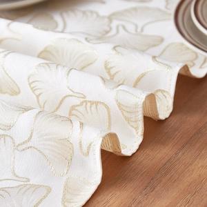 Luxury cream table runner with golden ginkgo leaf jacquard patterns for dining decor