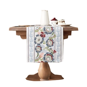 Classical floral table runner with blue and crimson blossoms on off-white linen fabric
