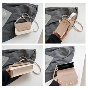 Detail view of contrast color crossbody bag with gold buckle and woven texture flap
