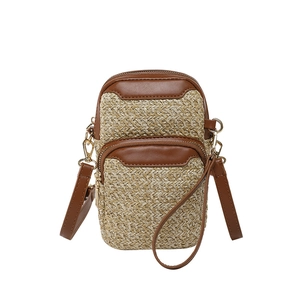 Handmade straw mini crossbody phone bag with brown leather trim and dual zipper pockets