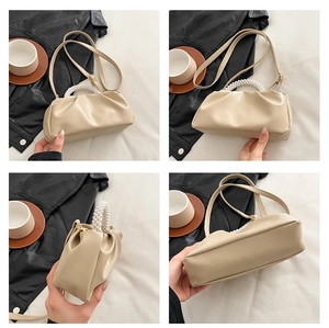 Detailed views of beige ruched cloud bag with pearl handle and leather strap