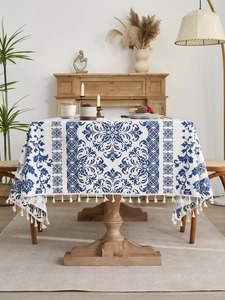 Detail of blue damascus pattern on rectangular cotton linen tablecloth with fringe