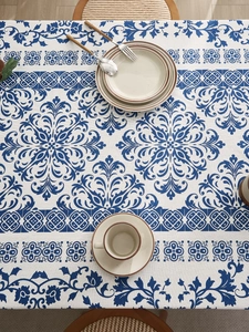 Top view of Chinese blue floral tablecloth with mandala patterns on a dining table