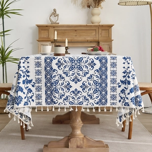 Blue and white porcelain style tablecloth with elegant fringe tassels for dining decor