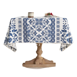 Rectangular blue and white damask pattern tablecloth with decorative white tassels