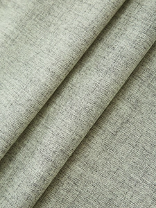 Dettaglio macro del tessuto di lino spesso che mostra la trama melange grigio-bianca
