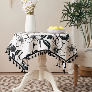 Linen round tablecloth with black floral print and elegant tassels for home decor
