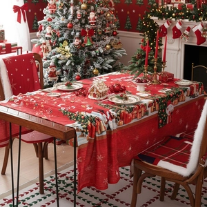 Festive red Christmas tablecloth with snowmen and trees for holiday dining decor