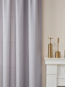 Detail of light gray-purple blackout curtains with fine horizontal woven texture
