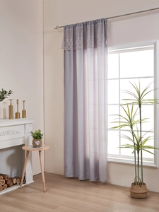 Detail of light purple sheer curtain with luxury lace valance for elegant home decor