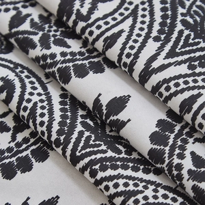 Close-up of European paisley pattern curtain fabric showing fine texture and weave
