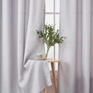 Minimalist light gray sheer curtain for living room with soft textured fabric and elegant drape