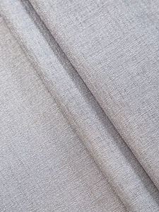 Detailed macro view of the grey linen-textured fabric with thick woven crosshatch pattern