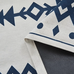 Detail of the navy geometric print linen fabric with non-slip back and stitched edges