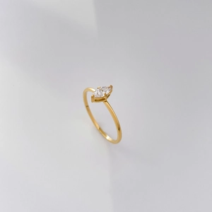 Detail showing marquise cut zircon and 18K gold plated twisted titanium steel ring