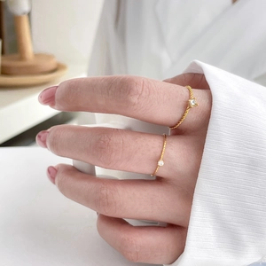 Minimalist 18K gold plated titanium rings set with sparkling zircon and twisted texture
