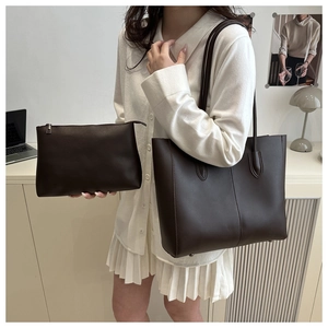 Detail of dark brown tote bag set with a matching zip pouch and minimalist design