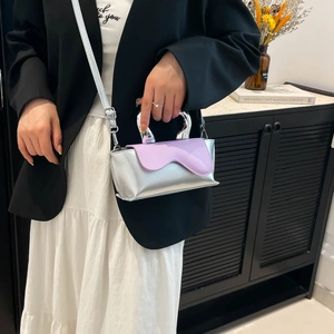 Silver mirror finish crossbody bag with lavender wavy flap and metal handle for women