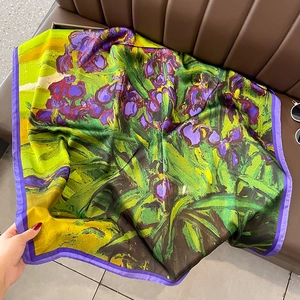 Detailed close-up of a large silk-feel scarf with Van Gogh Iris art print and satin luster