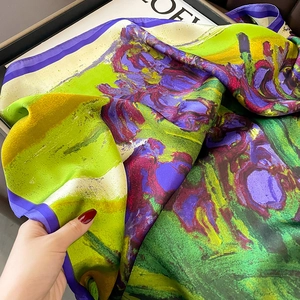 Detail of silk-like scarf with impressionist iris oil painting print and smooth texture