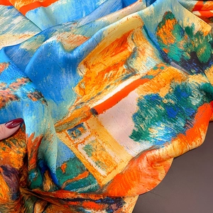 Detail of silk-feel scarf showing vibrant oil painting patterns and glossy satin texture