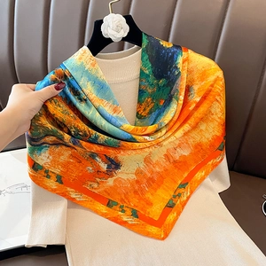 Artistic oil painting silk scarf with vibrant orange and blue patterns on elegant hanger