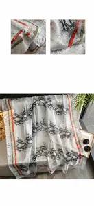 Detail of snake print long silk scarf with plant dyeing and high precision edge stitching