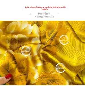 Macro shot of yellow silk fabric showing vibrant peony flower print and smooth texture