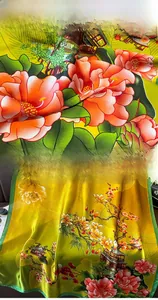 Detail of floral print silk scarf featuring vivid camellias and refined hem stitch