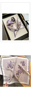 Detail of silk square scarf featuring purple iris prints and smooth glossy texture