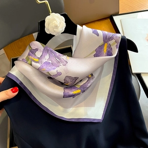 Silk square scarf featuring realistic lilac iris patterns on a navy sleeveless top
