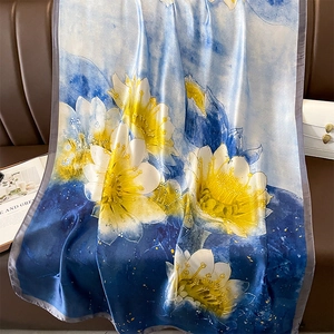 Elegant lotus flower silk scarf in blue gradient with large yellow floral prints