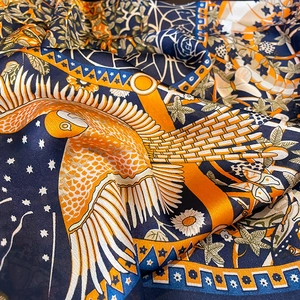 Artistic silk beach scarf with blue and orange vintage floral star pattern print