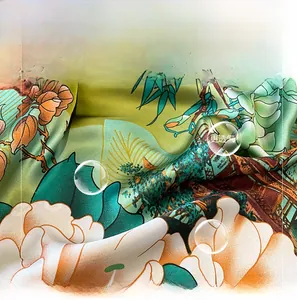 Macro shot of faux silk scarf fabric showing elegant lotus print and smooth texture