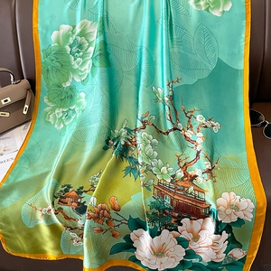Elegant teal silk scarf featuring traditional Chinese floral prints and gold edging