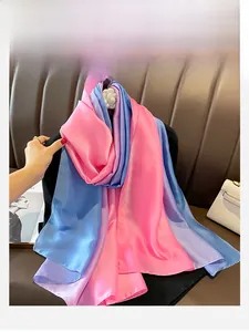 Detail of pink blue and purple gradient satin scarf with smooth silk texture