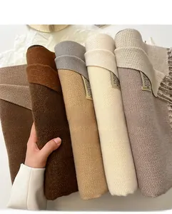 Detailed view of soft cashmere-like twill fabric texture in earthy warm color tones