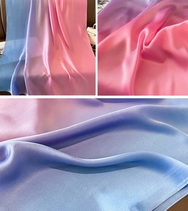 Detailed view of large gradient satin scarf showing soft blue to pink transitions