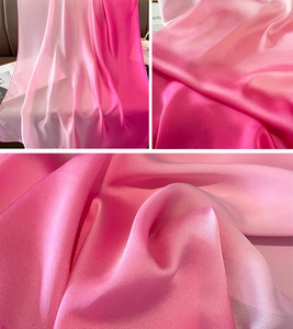 Detailed view of pink gradient satin scarf fabric with elegant glossy finish and soft drape