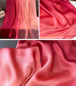 Detail of elegant gradient satin scarf with smooth silk texture and soft pearly luster