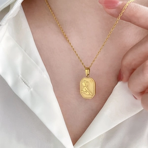 Vintage gold octagonal pendant necklace with female relief on a twisted rope chain