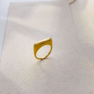 Vertical view of 18K gold plated square ring with polished metallic mirror surface