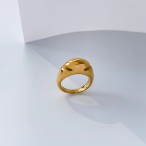 Detailed close-up of 18K gold-plated stainless steel ring with concave arc and hollow design