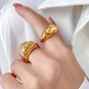 Set of two chunky minimalist 18K gold plated dome rings with wide curved grooved design