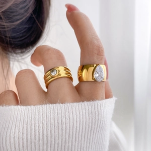 Modern 18K gold plated titanium ring set with oval and teardrop cubic zirconia stones