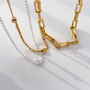 Minimalist silver plated ball bead and chunky link chain necklaces set on white