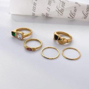 Golden titanium steel ring set with multi-colored zircon stones and hand-heart design